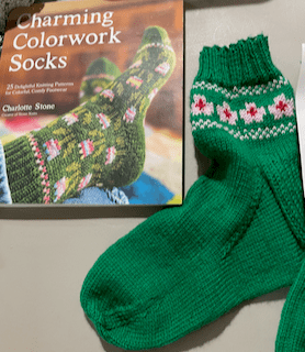 photo of Forget Me Knot sock and cover of Charming Colorwork Socks book